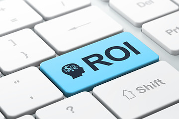 Image showing Finance concept: Head With Finance Symbol and ROI on computer ke