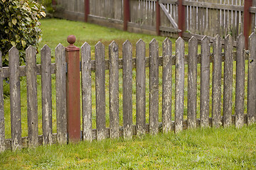 Image showing Weathered Fence and Green Grass