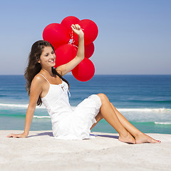 Image showing Girl with red ballons