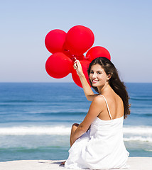 Image showing Girl with red ballons