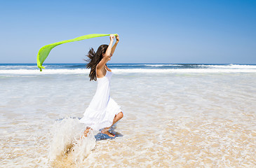 Image showing Jumping with a green tissue