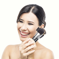 Image showing Asian woman with make-up brushes