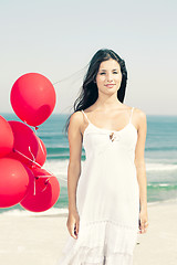 Image showing Beautiful girl holding red ballons