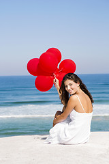 Image showing Girl with red ballons