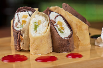 Image showing pancake roll with marmalade