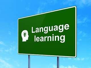 Image showing Education concept: Language Learning and Head With Light Bulb on road sign background