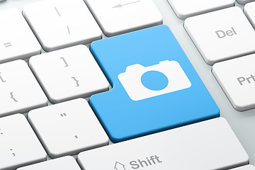 Image showing Travel concept: Photo Camera on computer keyboard background