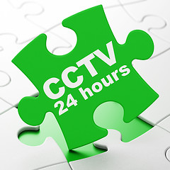Image showing Safety concept: CCTV 24 hours on puzzle background