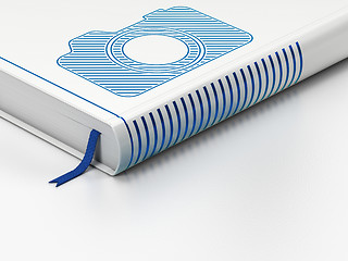 Image showing Travel concept: closed book, Photo Camera on white background