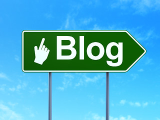 Image showing Web development concept: Blog and Mouse Cursor on road sign background