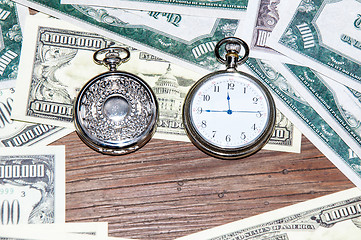 Image showing Pocket watches and money.