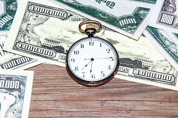 Image showing Pocket watches and money.