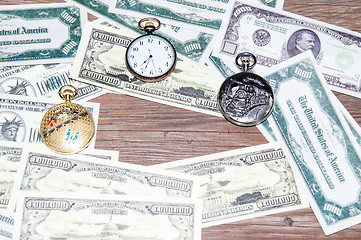 Image showing Pocket watches and money.