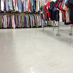 Image showing Colorful clothes for sale in a second hand store