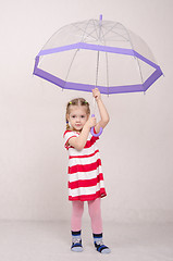 Image showing Three year old girl standing with umbrella