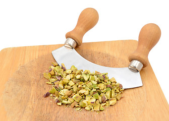 Image showing Chopped pistachios with a rocking knife