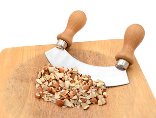 Image showing Chopped almonds with a rocking knife