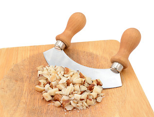 Image showing Chopped brazil nuts with a rocking knife