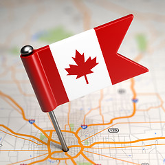 Image showing Canada Small Flag on a Map Background.