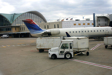 Image showing Close up on a Plane and cargo car