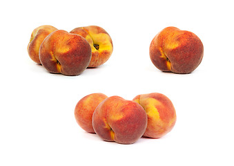 Image showing Set of tasty juicy peaches with slices on a white background