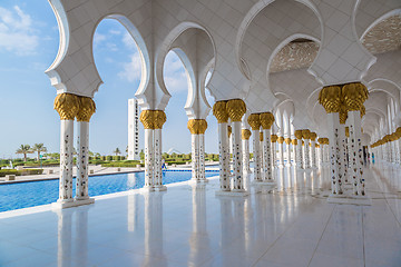 Image showing Hallway with golden decorated pillars at the entrance of the wor