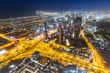 Image showing Dubai downtown night scene with city lights,