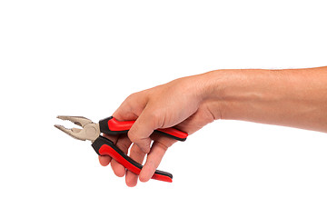 Image showing Male hand hold a black and red pliers