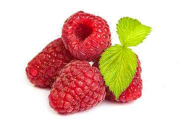 Image showing Bunch of a red raspberry on a white background. Close up macro s