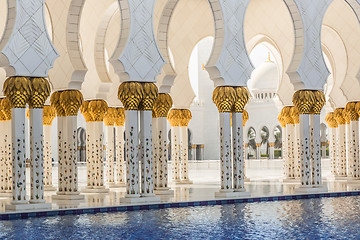 Image showing Hallway with golden decorated pillars at the entrance of the wor