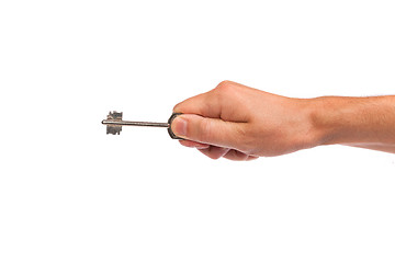 Image showing Male hand holding a key to the house