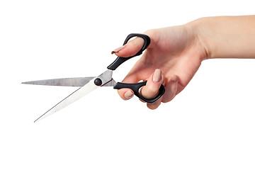 Image showing Hand is holding scissors isolated