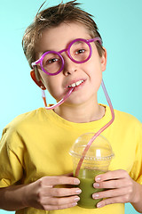 Image showing Boy with a healthy superjuice