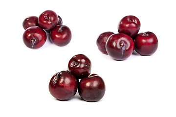 Image showing set of Group of plums  on white