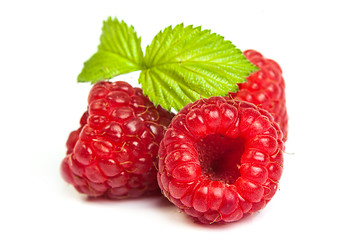 Image showing Bunch of a red raspberry on a white background. Close up macro s