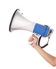 Image showing A woman is holding a loudspeaker