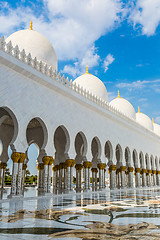 Image showing Hallway with golden decorated pillars at the entrance of the wor