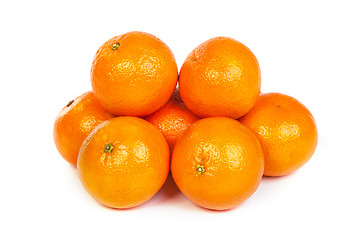 Image showing Group of ripe tangerine or mandarin with slices on white