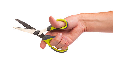 Image showing Hand is holding scissors isolated