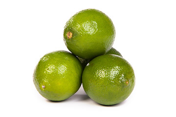 Image showing Group of whole limes  and one half lime on white