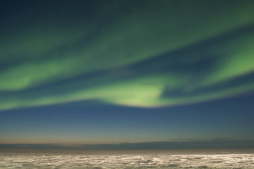 Image showing Swirl of aurora over arctic tundra