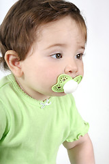 Image showing Baby with pacifier in mouth