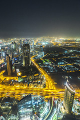 Image showing Dubai downtown night scene with city lights,