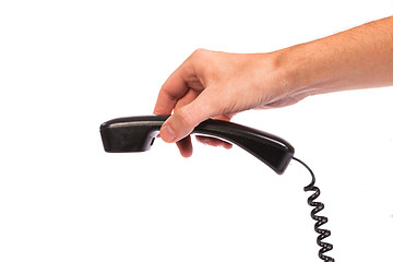 Image showing Hand holding an old black telephone tube