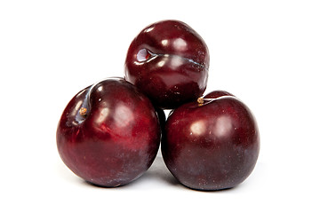 Image showing Group of plums  on white