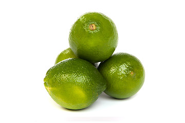 Image showing Group of whole limes  and one half lime on white