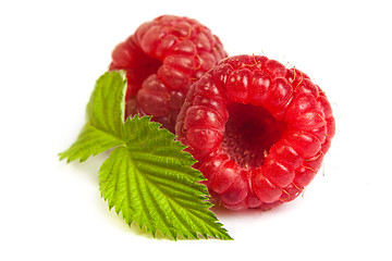 Image showing Bunch of a red raspberry on a white background. Close up macro s