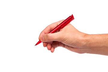 Image showing Hand hold a pen writing on the white