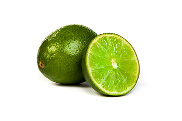 Image showing One whole lime and one half lime on white