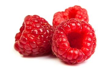 Image showing Bunch of a red raspberry on a white background. Close up macro s